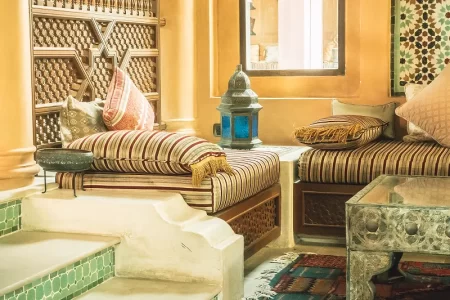 a room with a lamp and pillows as a part of Moroccan traditional art